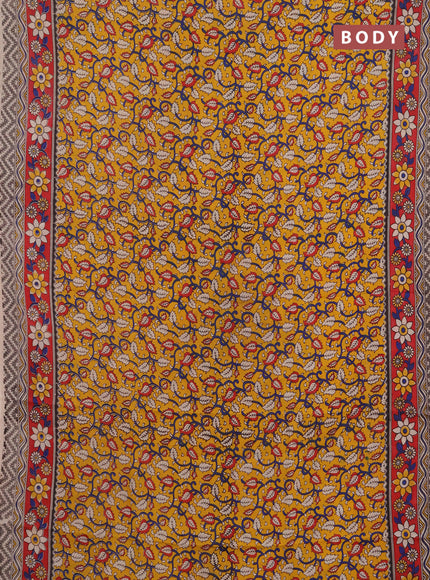 Kalamkari semi silk saree mustard yellow and red with allover prints and printed border