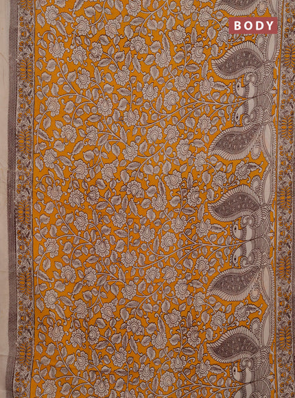 Kalamkari semi silk saree mustard yellow and beige with allover prints and printed border