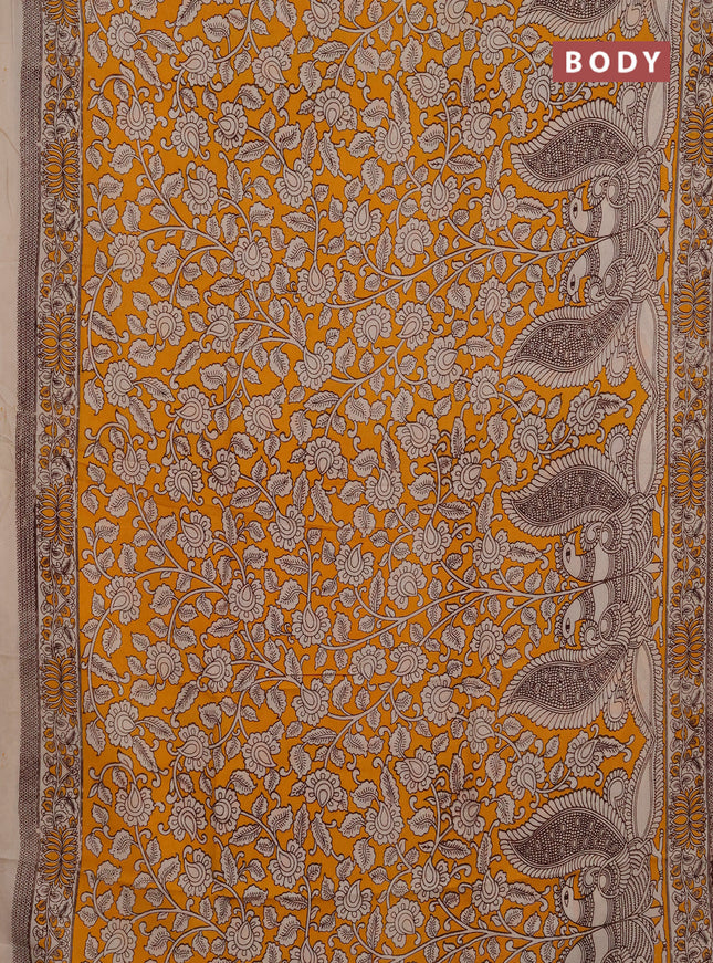 Kalamkari semi silk saree mustard yellow and beige with allover prints and printed border