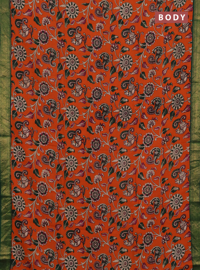 Kalamkari semi silk saree orange and green with allover prints and mangalgiri border