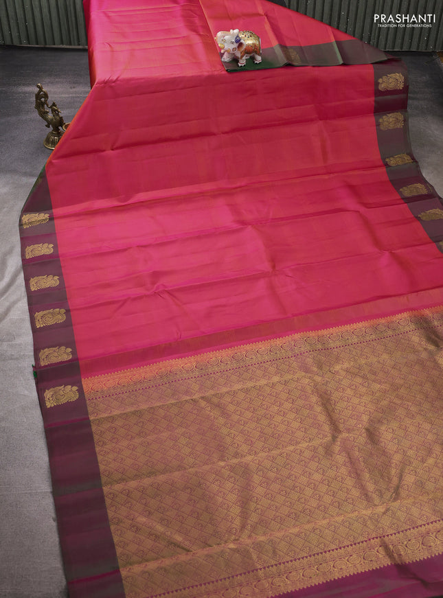 Pure kanchipuram silk saree dual shade of pinkish orange and dual shade of green with plain body and zari woven butta border
