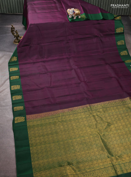 Pure kanchipuram silk saree deep purple and bottle green with plain body and zari woven butta border