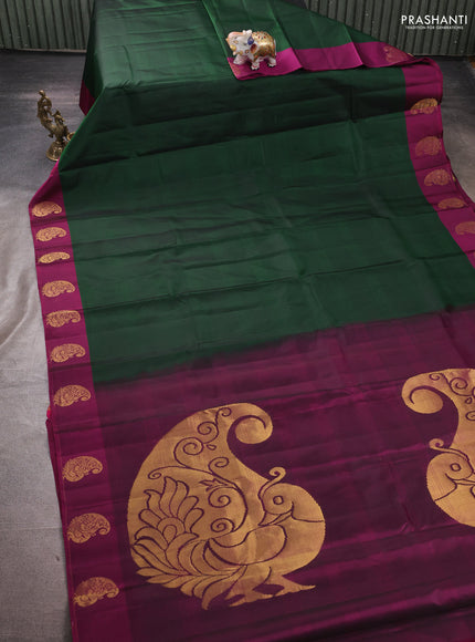 Pure kanchipuram silk saree bottle green and purple with plain body and zari woven butta border