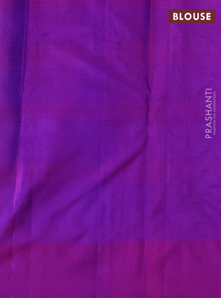 Pure kanchipuram silk saree dual shade of bluish green and purple with plain body and zari woven butta border