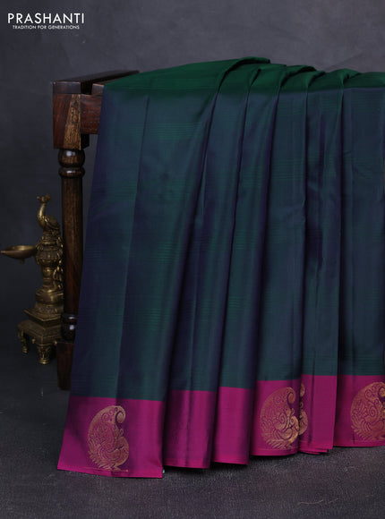 Pure kanchipuram silk saree dual shade of greenish violet and purple with plain body and zari woven butta border
