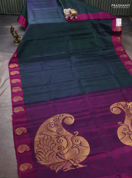 Pure kanchipuram silk saree dual shade of greenish violet and purple with plain body and zari woven butta border
