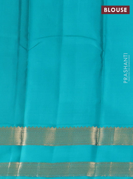 Pure kanchipuram silk saree dual shade of pinkish orange and teal blue with zari woven buttas and rettapet zari woven korvai border