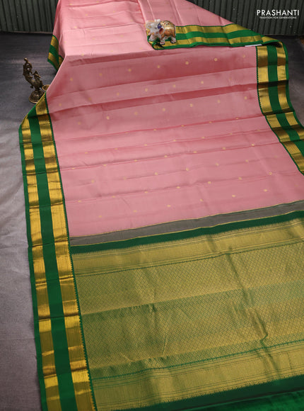 Pure kanchipuram silk saree pastel peach and green with zari woven buttas and rettapet zari woven korvai border