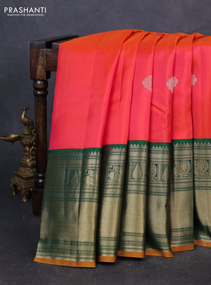 Pure kanchipuram silk saree pinkish orange and bottle green with zari woven buttas and long zari woven korvai border
