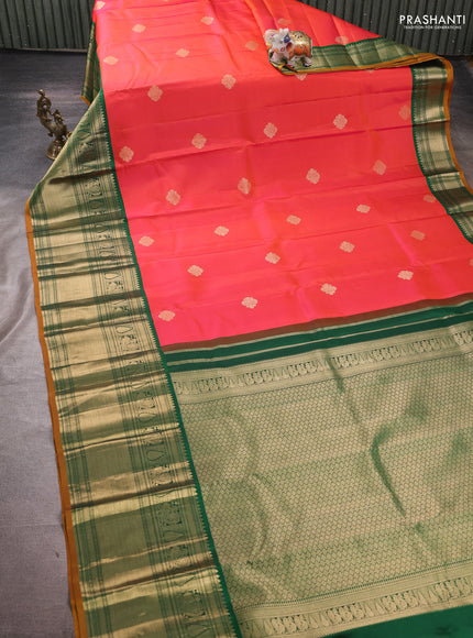 Pure kanchipuram silk saree pinkish orange and bottle green with zari woven buttas and long zari woven korvai border