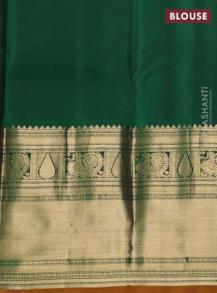 Pure kanchipuram silk saree pinkish orange and bottle green with zari woven buttas and long zari woven korvai border
