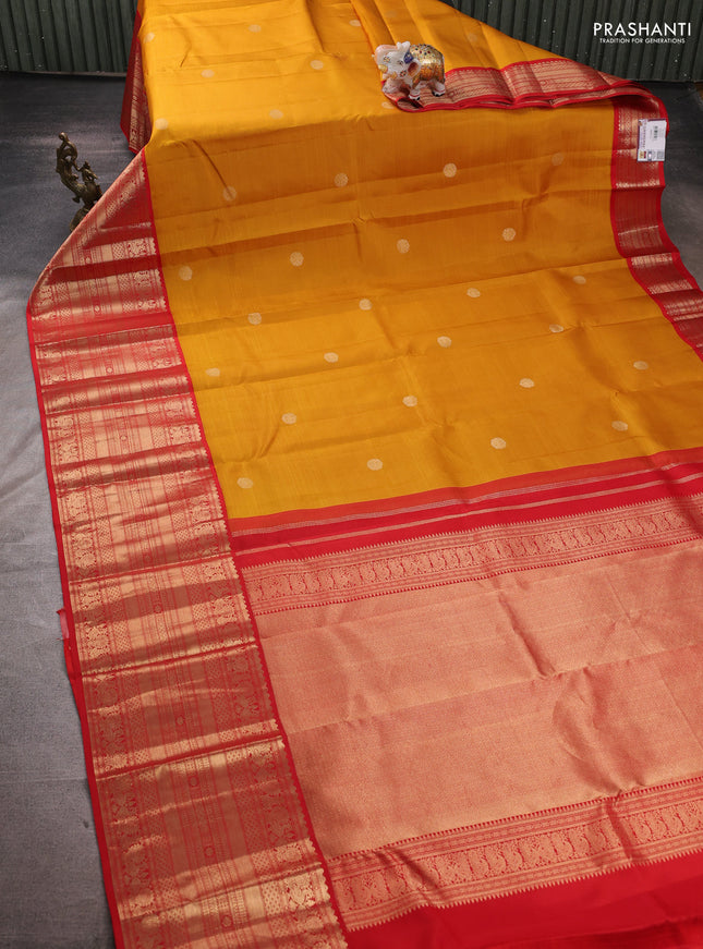 Pure kanchipuram silk saree mustard yellow and red with zari woven buttas and long zari woven korvai border