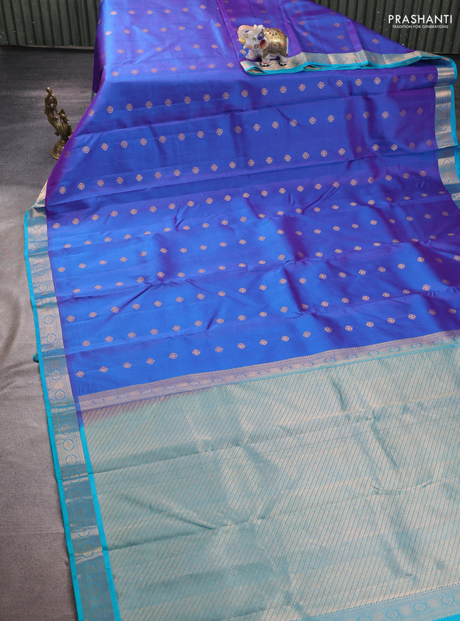 Pure kanchipuram silk saree dual shade of violet and teal blue with allover zari woven buttas and zari woven border