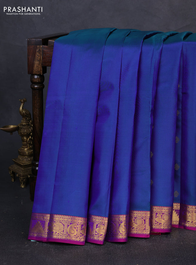 Pure kanchipuram silk saree dual shade of bluish green and purple with zari woven buttas and zari woven border