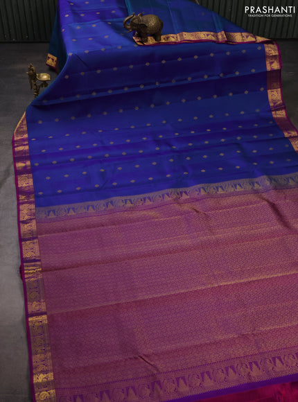 Pure kanchipuram silk saree dual shade of bluish green and purple with zari woven buttas and zari woven border