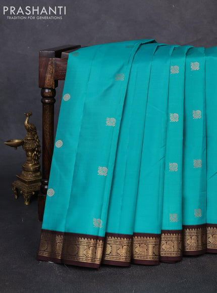 Pure kanchipuram silk saree teal blue and coffee brown with zari woven buttas and zari woven korvai border