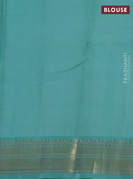 Pure kanchipuram silk saree dual shade od pinkish orange and teal blue with zari woven buttas and zari woven korvai border