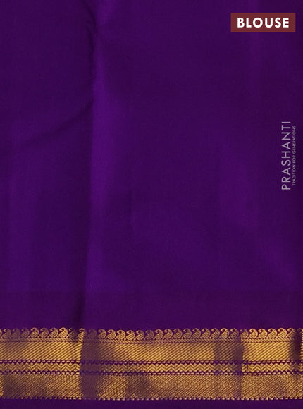 Pure kanchipuram silk saree dual shade od pinkish orange and purple with plain body and temple design zari woven korvai border
