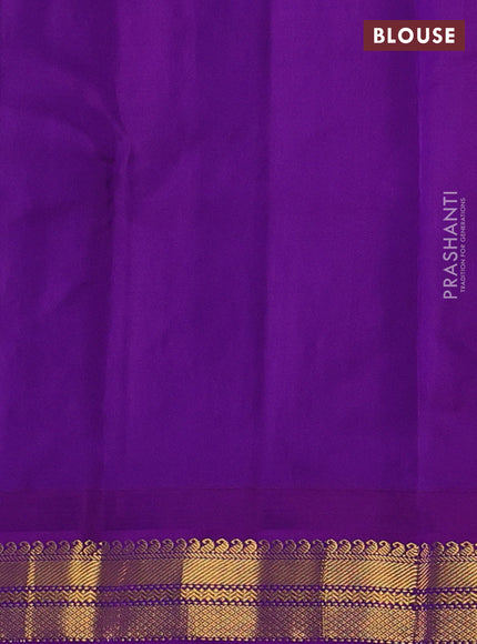 Pure kanchipuram silk saree teal blue and purple with plain body and temple design zari woven korvai border