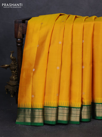 Pure kanchipuram silk saree yellow and green with zari woven buttas and temple design zari woven korvai border