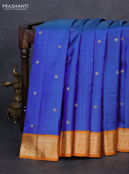 Pure kanchipuram silk saree dual shade of blue and dark mustard with allover vairaosi pattern & buttas and zari woven korvai border