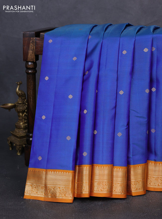 Pure kanchipuram silk saree dual shade of blue and dark mustard with allover vairaosi pattern & buttas and zari woven korvai border