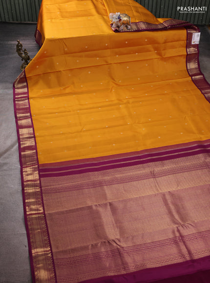 Pure kanchipuram silk saree mustard yellow and purple with zari woven buttas and zari woven korvai border