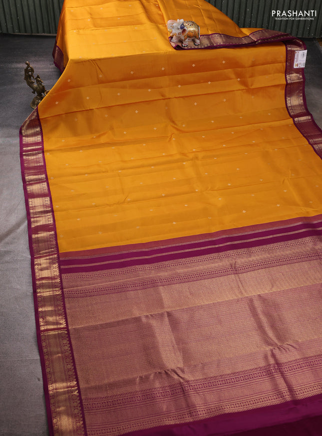 Pure kanchipuram silk saree mustard yellow and purple with zari woven buttas and zari woven korvai border