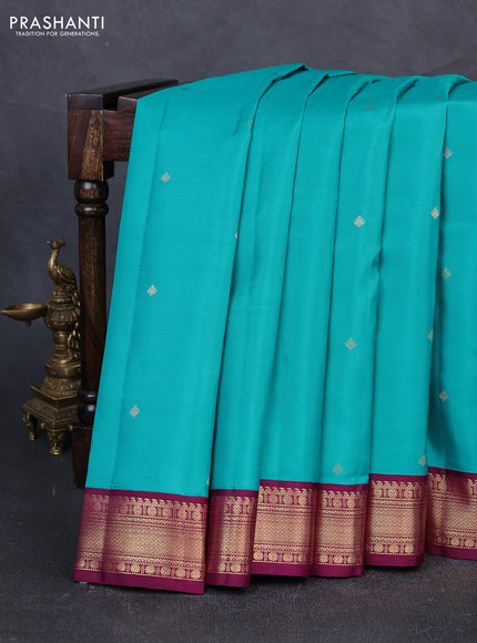 Pure kanchipuram silk saree teal blue and purple with zari woven buttas and zari woven korvai border