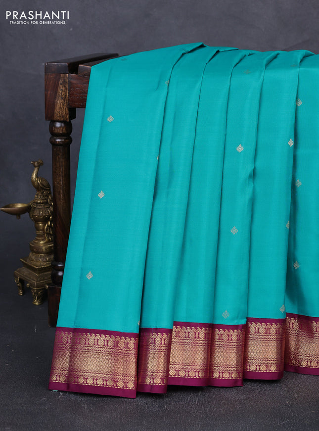 Pure kanchipuram silk saree teal blue and purple with zari woven buttas and zari woven korvai border