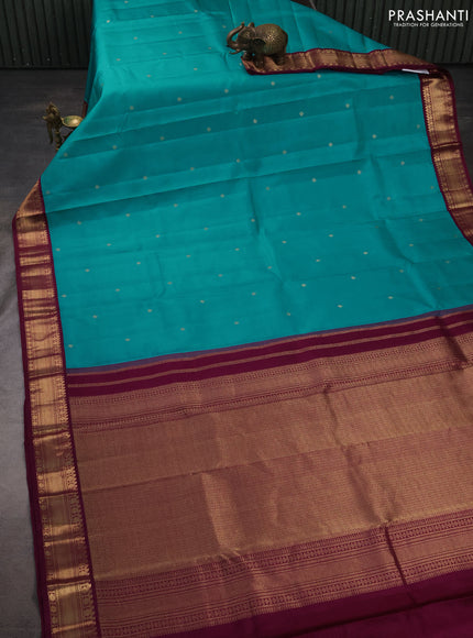 Pure kanchipuram silk saree teal blue and purple with zari woven buttas and zari woven korvai border