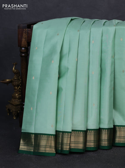 Pure kanchipuram silk saree teal green shade and green with zari woven buttas and zari woven korvai border