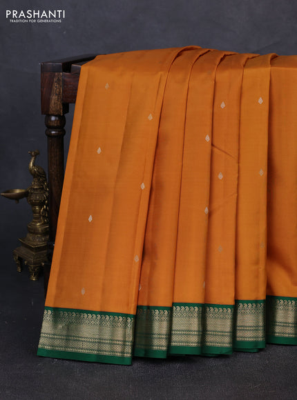 Pure kanchipuram silk saree dark mustard and green with zari woven buttas and zari woven korvai border