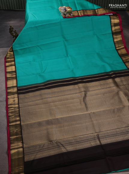 Pure kanchipuram silk saree teal blue and coffee brown with allover zari stripe pattern and zari woven korvai border