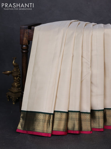 Pure kanchipuram silk saree cream and bottle green with allover zari stripe pattern and zari woven korvai border