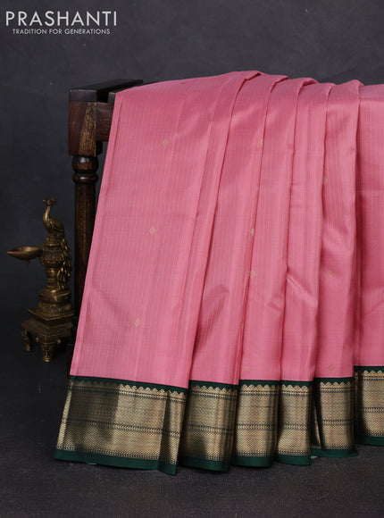 Pure kanchipuram silk saree light pink and dark green with allover zari weaves and zari woven korvai border