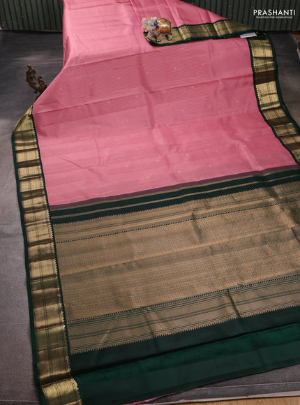 Pure kanchipuram silk saree light pink and dark green with allover zari weaves and zari woven korvai border