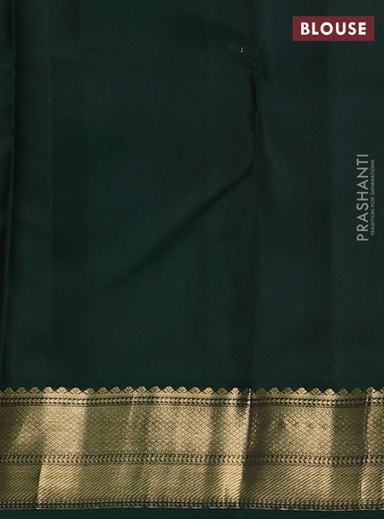 Pure kanchipuram silk saree light pink and dark green with allover zari weaves and zari woven korvai border