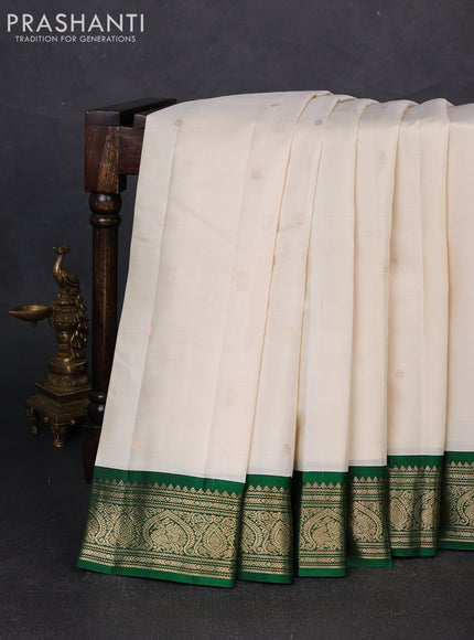 Pure kanchipuram silk saree off white and green with zari woven buttas and zari woven korvai border