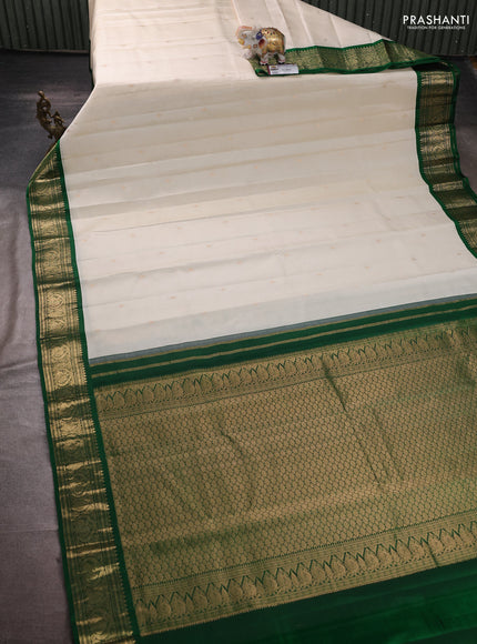 Pure kanchipuram silk saree off white and green with zari woven buttas and zari woven korvai border