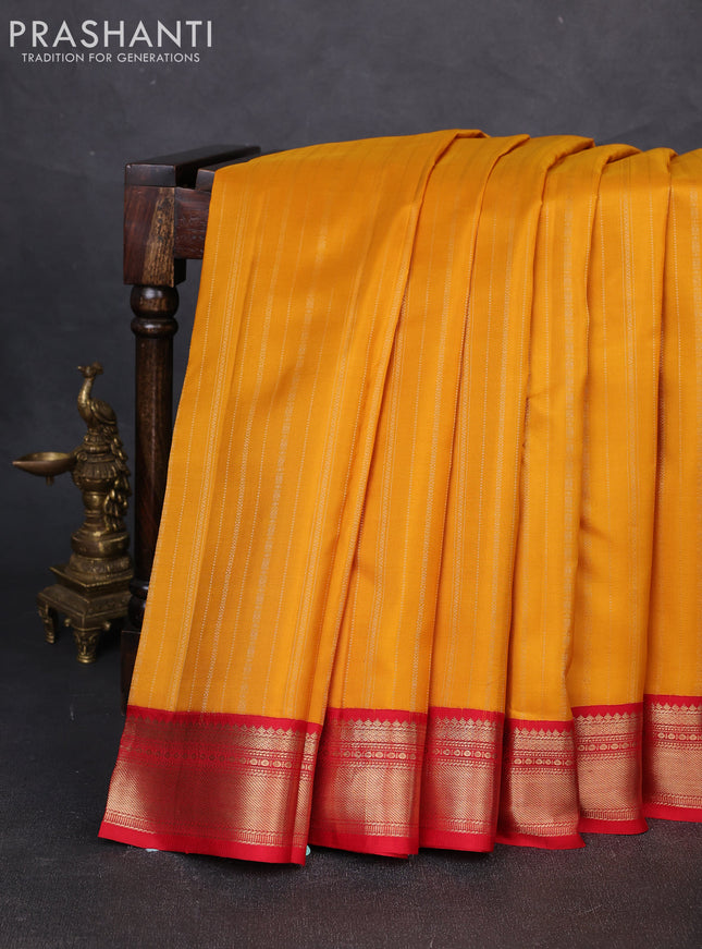Pure kanchipuram silk saree mustard yellow and red with allover zari weaves and zari woven korvai border