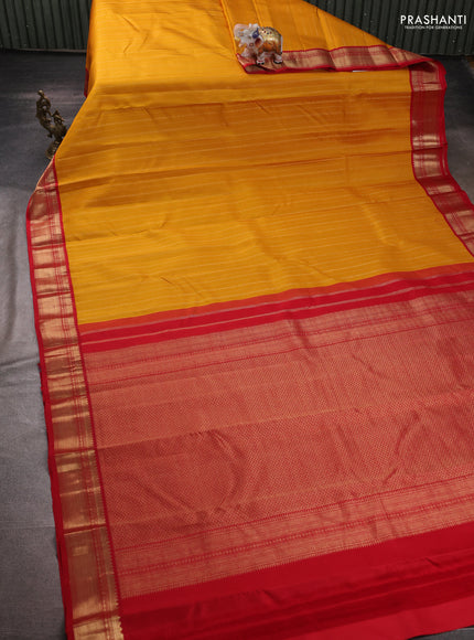 Pure kanchipuram silk saree mustard yellow and red with allover zari weaves and zari woven korvai border