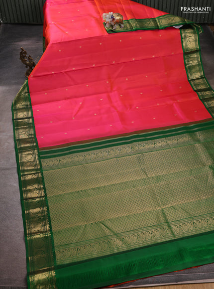 Pure kanchipuram silk saree pinkish orange and green with zari woven paisley buttas and zari woven korvai border