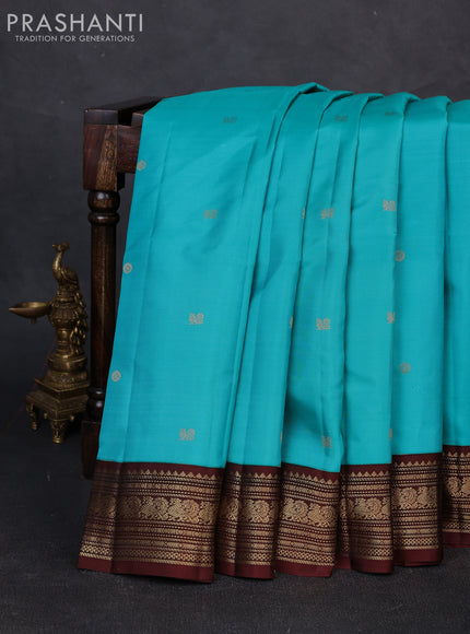 Pure kanchipuram silk saree teal blue and coffee brown with zari woven buttas and zari woven korvai border