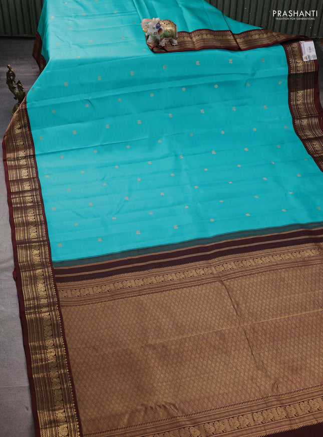 Pure kanchipuram silk saree teal blue and coffee brown with zari woven buttas and zari woven korvai border