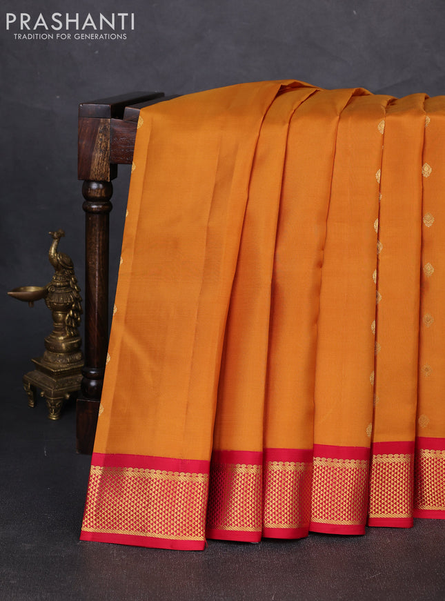 Pure kanchipuram silk saree dark mustard and reddish pink with zari woven buttas and zari woven korvai border