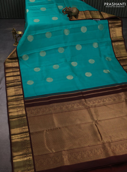 Pure kanchipuram silk saree teal blue and coffee brown with zari woven buttas and zari woven korvai border