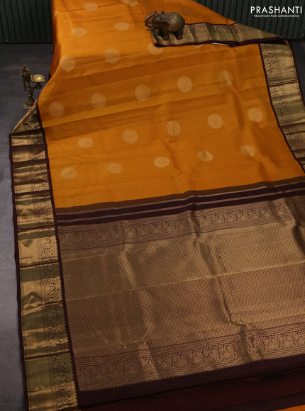 Pure kanchipuram silk saree mustard yellow and deep maroon with zari woven buttas and zari woven korvai border