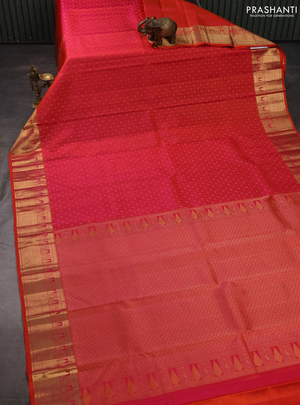 Pure kanchipuram silk saree dual shade of pinkish orange with allover zari woven 1000 buttas and zari woven border