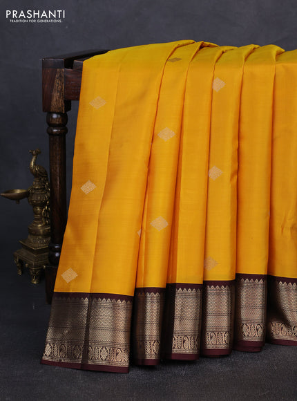 Pure kanchipuram silk saree yellow and coffee brown with zari woven buttas and zari woven korvai border